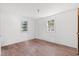 Simple bedroom with laminate flooring and two windows at 45 Steve Carmichael Rd., Hemingway, SC 29554