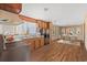 Kitchen features wood cabinets, double sink, and a view to dining area at 45 Steve Carmichael Rd., Hemingway, SC 29554