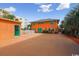 Exterior view of beach house with orange walls and a green shed at 4501 S Ocean Blvd., North Myrtle Beach, SC 29582