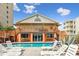 Inviting pool area with lounge chairs and house view at 4501 S Ocean Blvd., North Myrtle Beach, SC 29582