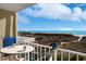 Ocean view balcony with table and chairs at 4605 S Ocean Blvd. # E-1, North Myrtle Beach, SC 29582