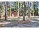 Wooden shed nestled in a wooded backyard setting at 47 Byers Trail, Pawleys Island, SC 29585