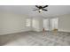 Large bedroom with carpet flooring and access to bathroom at 47 Byers Trail, Pawleys Island, SC 29585