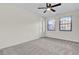 Well-lit bedroom with carpet flooring and ceiling fan at 47 Byers Trail, Pawleys Island, SC 29585