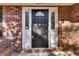 Dark wood front door with sidelights and arched window at 47 Byers Trail, Pawleys Island, SC 29585