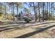 Brick house with a large backyard surrounded by trees at 47 Byers Trail, Pawleys Island, SC 29585