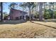 Brick house exterior with a large backyard and trees at 47 Byers Trail, Pawleys Island, SC 29585