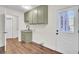 Bright laundry room, featuring stylish cabinets and exterior access at 47 Byers Trail, Pawleys Island, SC 29585