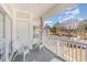 Relaxing balcony with white wicker chairs, offering a view of the community at 4781 Wild Iris Dr. # 304, Myrtle Beach, SC 29577