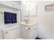 Small bathroom with white vanity and blue towels at 4781 Wild Iris Dr. # 304, Myrtle Beach, SC 29577