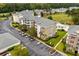 Aerial view of an apartment building complex with a pool and ample parking at 4894 Luster Leaf Circle # 402, Myrtle Beach, SC 29577