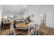 Bright dining area with wood table and white chairs at 4894 Luster Leaf Circle # 402, Myrtle Beach, SC 29577