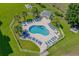 Refreshing community pool with palm trees and lounge chairs at 4894 Luster Leaf Circle # 402, Myrtle Beach, SC 29577