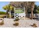 The Retreat community entrance sign with white fence and landscaping at 518 Cordgrass Ln., Little River, SC 29566