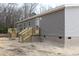 House back with deck and wooden stairs leading to the ground at 5225 Hwy 712, Galivants Ferry, SC 29544