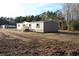 Gray vinyl siding house with wooden steps on a large lot at 5225 Hwy 712, Galivants Ferry, SC 29544