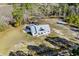 Aerial view of house on a large lot with surrounding trees at 5300 Juniper Bay Rd., Conway, SC 29527