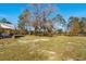 Large backyard with mature trees and grassy area at 5300 Juniper Bay Rd., Conway, SC 29527