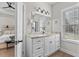 Bathroom with white vanity, granite countertop, and walk-in shower at 5300 Juniper Bay Rd., Conway, SC 29527