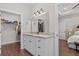 Modern bathroom with granite vanity and walk-in closet access at 5300 Juniper Bay Rd., Conway, SC 29527