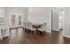 Dining area with wooden table and chairs, near kitchen and bathroom at 5300 Juniper Bay Rd., Conway, SC 29527