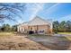 White house exterior with covered porch and large backyard at 5300 Juniper Bay Rd., Conway, SC 29527