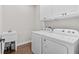 Laundry room with washer, dryer, and cabinets at 5300 Juniper Bay Rd., Conway, SC 29527