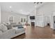 Living room with sectional sofa, built-in shelving, and fireplace at 5300 Juniper Bay Rd., Conway, SC 29527