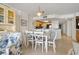 Casual dining area with white table and chairs near kitchen at 5308 N Ocean Blvd. # 601, Myrtle Beach, SC 29577