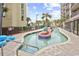 Lazy river style pool with blue floats at 5308 N Ocean Blvd. # 701, Myrtle Beach, SC 29577