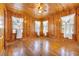 Hardwood floor bedroom with wood walls and ceiling at 5515 Porcher Dr., Myrtle Beach, SC 29577