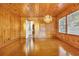 Dining room with wood paneled walls and hardwood floors at 5515 Porcher Dr., Myrtle Beach, SC 29577