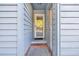 Small entryway with light blue walls and a white door at 5515 Porcher Dr., Myrtle Beach, SC 29577