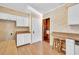 View of kitchen, white cabinets, wood countertops at 5515 Porcher Dr., Myrtle Beach, SC 29577