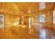 Living room with wood paneled walls and hardwood floors at 5515 Porcher Dr., Myrtle Beach, SC 29577