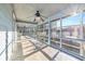 Large screened porch with ceiling fan and ample natural light at 5515 Porcher Dr., Myrtle Beach, SC 29577