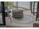 Oceanfront balcony featuring a stylish pouf on a mosaic tile rug at 5523 N Ocean Blvd. # 1601, Myrtle Beach, SC 29577