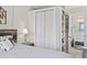Bedroom featuring closet with shelving that opens to the bathroom and vanity at 5523 N Ocean Blvd. # 1601, Myrtle Beach, SC 29577