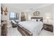 Bright bedroom with a cozy sitting chair, rustic wood furniture and scenic outside view at 5523 N Ocean Blvd. # 1601, Myrtle Beach, SC 29577
