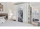 Open closet showcases clothes and shelving in this bedroom connecting to the bathroom at 5523 N Ocean Blvd. # 1601, Myrtle Beach, SC 29577