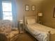 Small bedroom with twin bed and recliner at 557 White River Dr. # 12A, Myrtle Beach, SC 29579