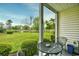 Screened porch with table and chairs overlooking pond at 557 White River Dr. # 12A, Myrtle Beach, SC 29579