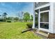 View of pond from screened porch with table and chairs at 557 White River Dr. # 12A, Myrtle Beach, SC 29579