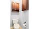 Convenient bathroom with dark wood cabinets and toilet at 569 Miromar Way, Myrtle Beach, SC 29588