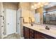 Double vanity bathroom with large mirror and shower at 569 Miromar Way, Myrtle Beach, SC 29588