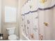 Bright bathroom with a shower/tub and butterfly-themed shower curtain at 569 Miromar Way, Myrtle Beach, SC 29588