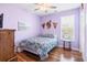 Charming bedroom with hardwood floors, ceiling fan and light purple walls at 569 Miromar Way, Myrtle Beach, SC 29588