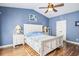 Bedroom with white bed frame and light blue walls at 569 Miromar Way, Myrtle Beach, SC 29588