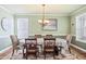 Formal dining room features hardwood floors and chandelier at 569 Miromar Way, Myrtle Beach, SC 29588