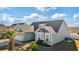 Exterior view of a charming two-story house with gray siding and stone accents at 569 Miromar Way, Myrtle Beach, SC 29588